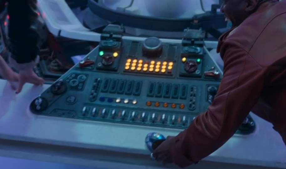 The Doctor and Ruby hold on to the console. (TV: Space Babies [+]Loading...["Space Babies (TV story)"])