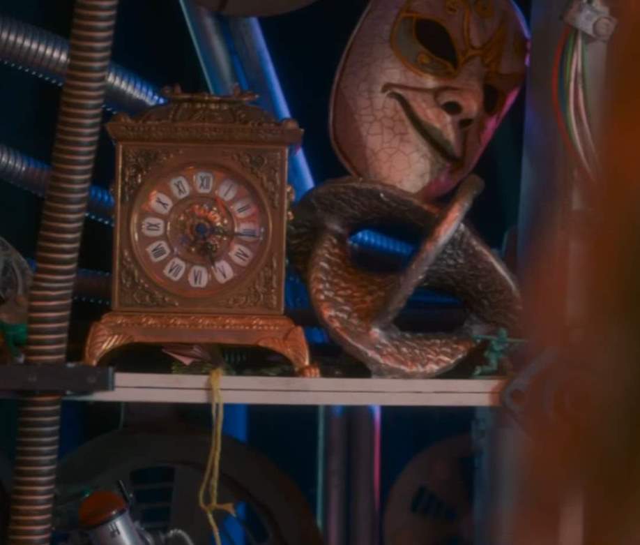A clock and a Clockwork Droid mask among the TARDIS’ decorations. (TV: Vengeance on Varos [+]Loading...["Vengeance on Varos (TotT TV story)"])