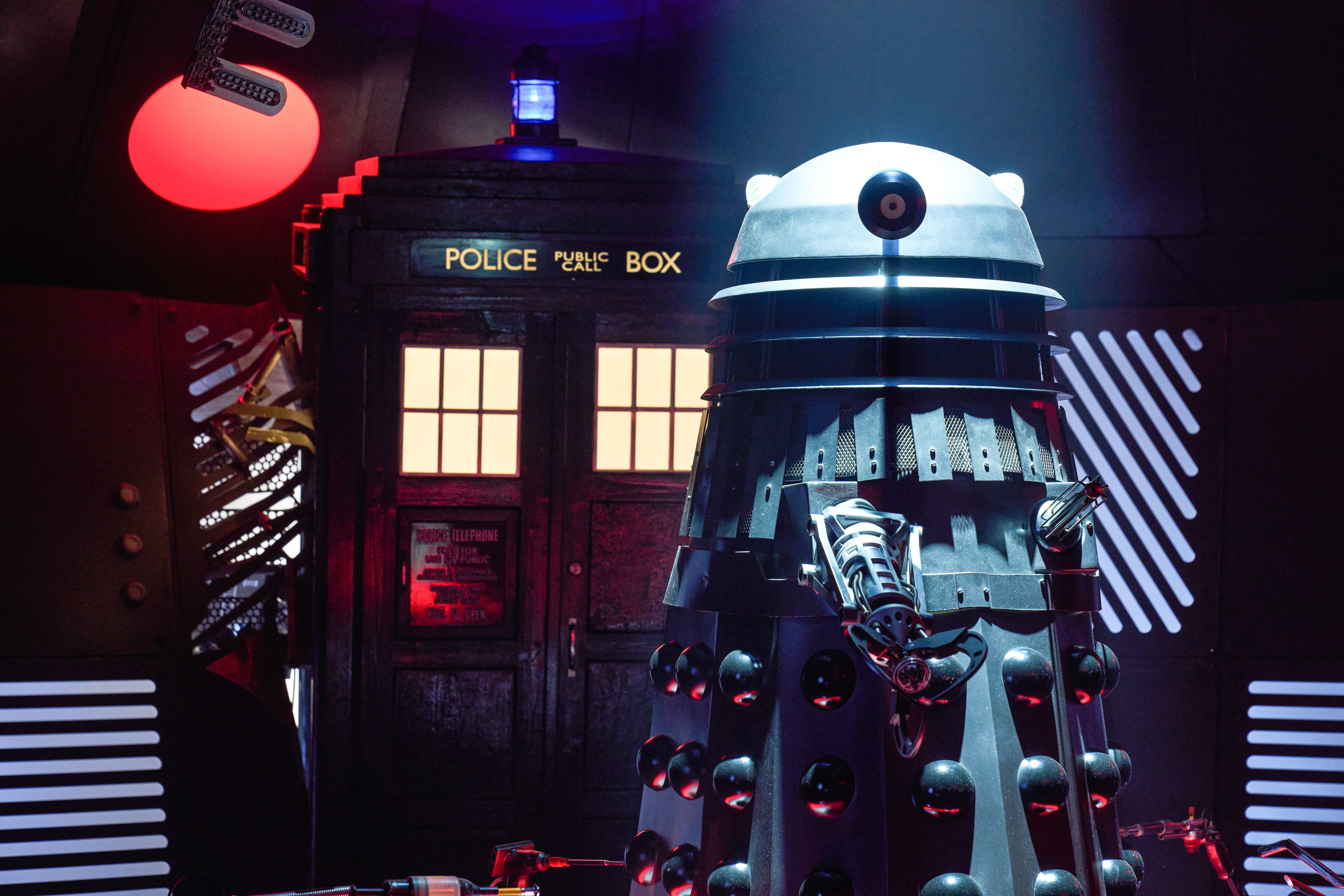 A Dalek in front of the TARDIS.