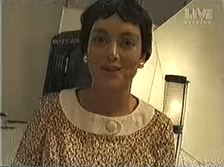 An actress dressed as Valerie Singleton.