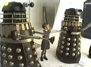 Scott with a pair of Daleks, near the TARDIS.