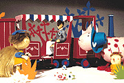 Image of a boy arriving in the Magic Garden aboard the Train.[2]