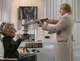 The Doctor holds Davros at gunpoint.