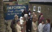 A crowd gathers at Foreman's Yard in 1963 after a soldier's death