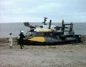 Jo and Hart run for hovercraft - Sea Devils.jpg