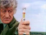 The Third Doctor levels his sonic screwdriver