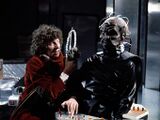 The Fourth Doctor struggles with Davros.