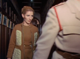 Liz follows the Brigadier through the hospital corridors.