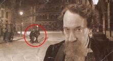 A photograph of Charles Dickens, with the Doctor and Rose walking past in the background.