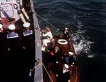 Doctor and Jo climb aboard dive ship.jpg