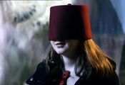 The young Amelia Pond in a fez