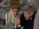 The Doctor and Liz examine the debris together.