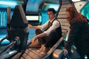 The Doctor and Donna in the cockpit.