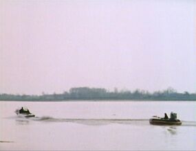 Doctor in hovercraft in pursuit of boat wide shot.jpg