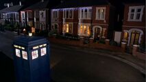 The TARDIS materialises outside the Nobles' home.