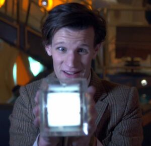 Eleventh-doctor-holds-hypercube.jpg