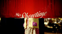 The It's Showtime [+]Loading...["It's Showtime (TV story)"] banner falls in front of Agnes.