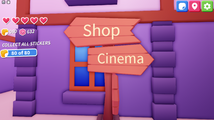 Signs for the shop and cinema.