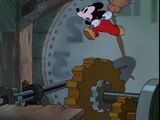 Mickey jumps from the cog.