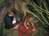 At Sam Seeley's house, Liz examines Meg Seeley while the Doctor picks up an energy unit.