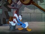 Donald Duck washes his mop in Clock Cleaners.