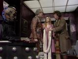 Davros sulks in a corner as the Doctor, Romana II and Tyssan talk escape routes.