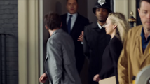 Rob and Sarah walk past as the Prime Minister exits 10 Downing Street.