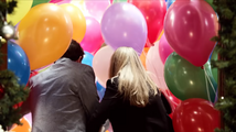 Rob and Sarah push through the balloons.