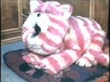 Bagpuss stretches and yawns.