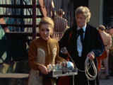 The Doctor and Liz sneak off.