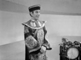 Slowly stepping forwards with his hands clasped, the Toymaker taunts the Doctor.