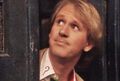 The Fifth Doctor, as played by Peter Davison from 1981 to 1984. He's peaking out of the TARDIS doors. (Frontios, BBC1)