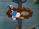 Donald gets stuck in a cog.