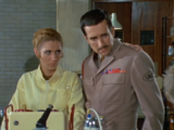 A concerned Liz and Brigadier ask the Doctor where the unit's signals are being transmitted.