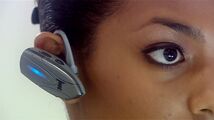 Close-up of Adeola's earpiece.