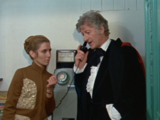 Liz listens in as the Doctor tries to call the Brigadier over the telephone.